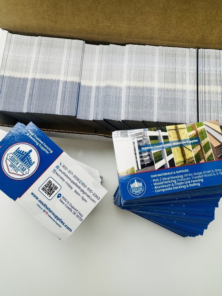 Stacks of printed business cards for South Star Supplies